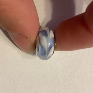 Pandora Light Blue Swirly Swirl Murano glass charm with a sterling silver core.